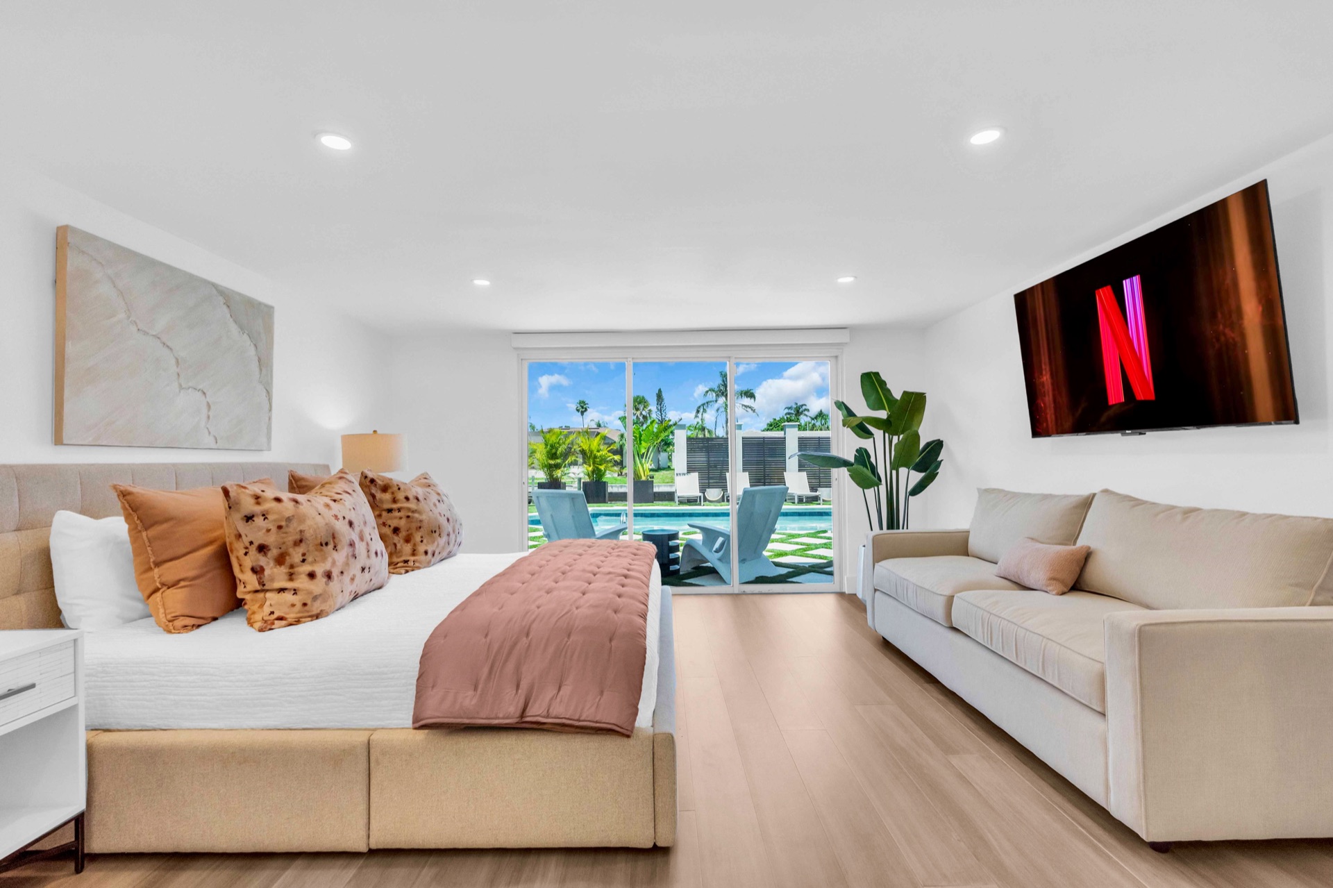 Primary suite with king bed and private pool access at Tampa luxury rental