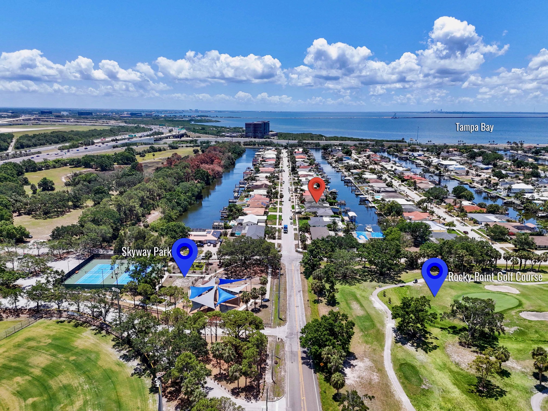 Aerial view of the Rocky Point waterfront neighborhood, canals and golf course near Tampa Luxury Stay